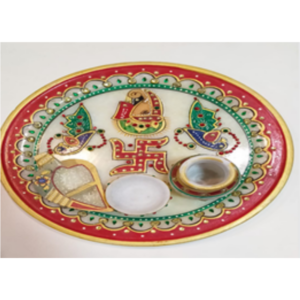 Marble puja thali with three articles.