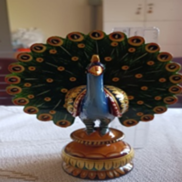 Wooden handpainting/jali work dancing peacock.
